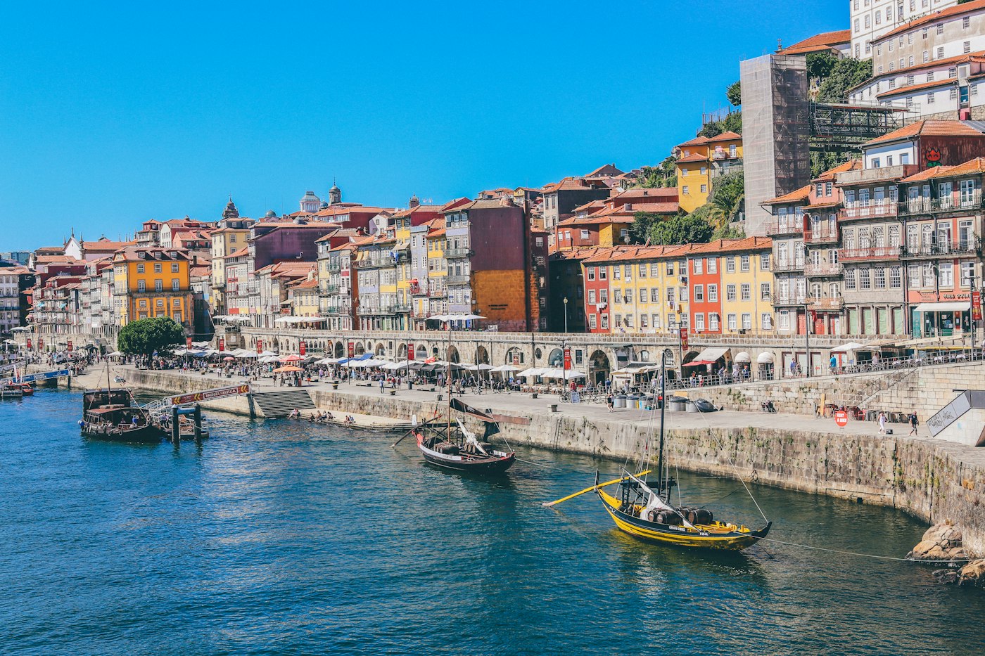 Lisbon's waterfront, colorful buildings, and boats